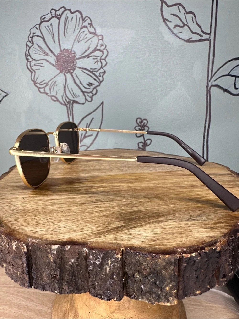 Calvin Klein Gold Frame Sunglasses with Dark Lenses